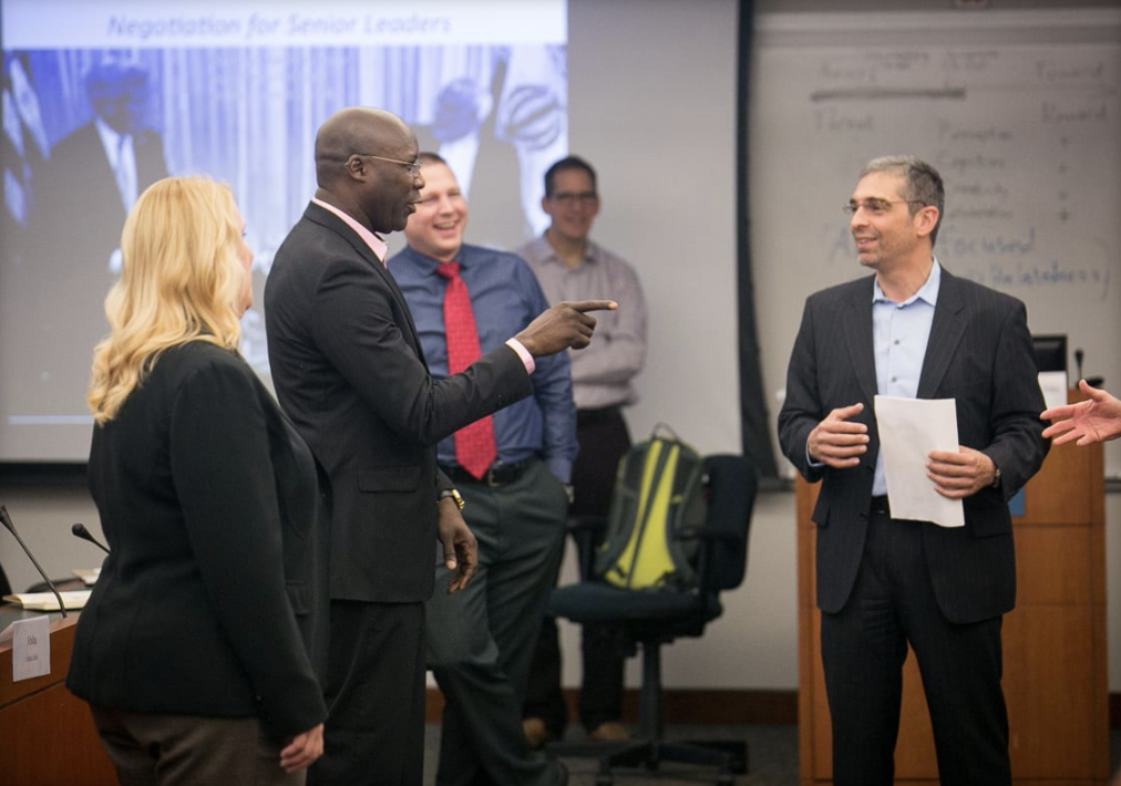 Group of presenters having a discussion.